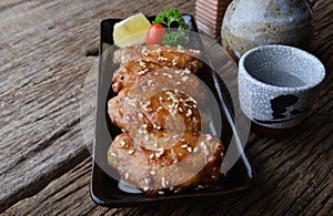 Fried chicken wing with spicy sauce in Japanese style. photo