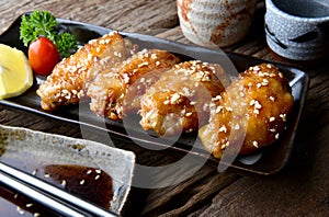 Fried chicken wing with spicy sauce in Japanese tebasaki style. photo