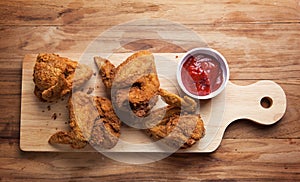 Fried chicken wing with tomato sauce