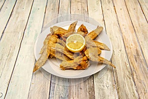 Fried chicken wings in the kitchen of a Spanish tapas restaurant