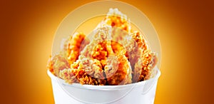 Fried chicken wings and legs. Bucket of crispy kentucky fried chicken