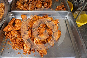 Fried chicken wings on tray gray