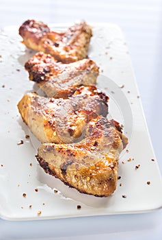 Fried chicken wings on the white plate