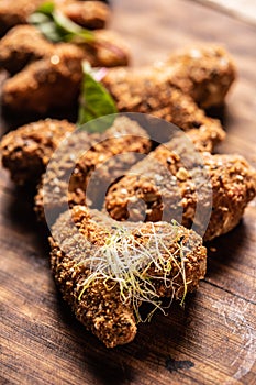 Fried chicken wings on wooden butcher board