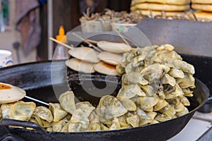 Fried Chinese traditional spring rolls in market