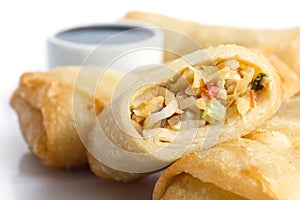 Fried chinese vegetable spring rolls on white.