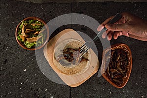 Fried chinicuiles with tortilla chips and guacamole