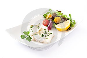 Fried cod fillet and salad in plate isolated