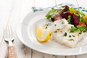 Fried cod fillet and salad