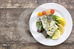 Fried cod fillet and salad