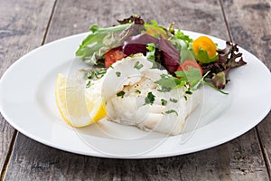 Fried cod fillet and salad
