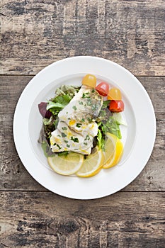 Fried cod fillet and salad
