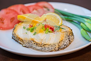 Fried cod fillets and vegetables