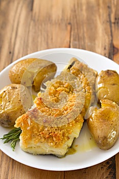 Fried cod fish with bread and potato