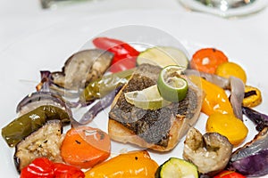 Fried cod with roasted vegetables.