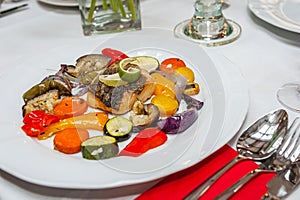 Fried cod with roasted vegetables.