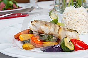 Fried cod with roasted vegetables.