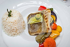 Fried cod with roasted vegetables.