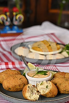 Fried codfish fritter typical Portuguese and Brazilian cuisine fish with herbs