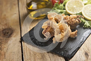 Fried crispy calamari served on plate