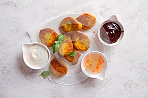 Fried crispy chicken nuggets with sauces