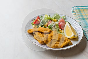 Fried Crispy Sardine Fish Plate with Salad and Lemon / Seafood Sardalya.