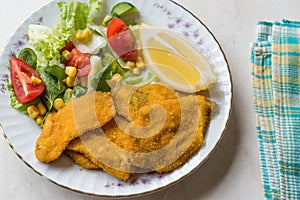 Fried Crispy Sardine Fish Plate with Salad and Lemon / Seafood Sardalya.