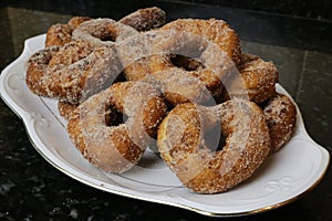 Fried donuts with sugar a typical sweet in Easter and Lent