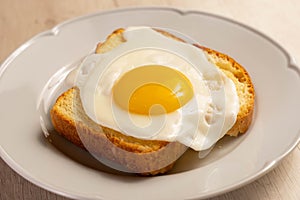 Fried egg above a toast