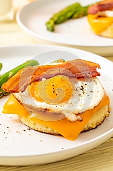 fried egg with bacon and cheese on pancake