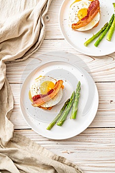 fried egg with bacon and cheese on pancake