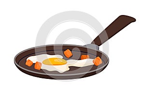 Fried egg with bacon or meat pieces in steel pan, cooked farm egg and ham or sausage
