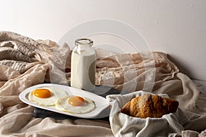 Fried egg with bread and coffee with milk