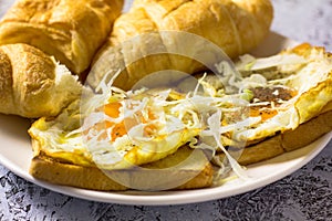 Fried egg and bread placed on the table