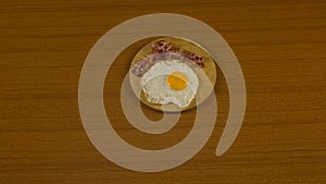 fried egg, with hen drawn, hard-boiled egg with yellow yolk coming out on the cutting board photo