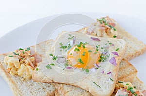 Fried egg inside toast, scrambled eggs