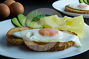 Fried egg with knife and fork