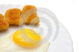 Fried egg and nuggets copy space