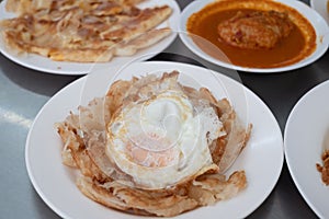 Fried Egg with Roti and Curry chicken