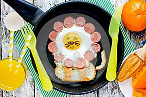 Fried egg with sausage and toast shaped lion