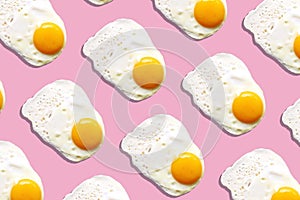 Fried egg or scrambled eggs pattern on pink background. Creative food concept. Top view. Conceptual trend. Banner. Keto diet.