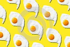 Fried egg or scrambled eggs pattern on yellow background. Creative food concept. Top view. Conceptual trend. Banner. Keto diet.