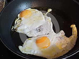 Fried egg sunny side up in A non-stick high quality frying pan