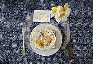 Fried egg on toast with good morning greeting card