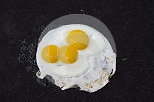 Fried Eggs On Asphalt Driveway