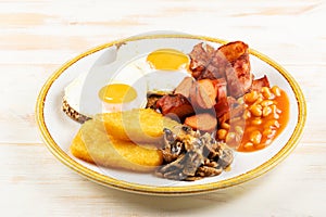 Fried eggs with bbq sausage, nuggets and mushrooms. Î’reakfast concept