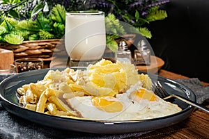 Fried eggs with boiled potatoes and yellow string beans