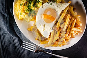 Fried eggs with boiled potatoes and yellow string beans