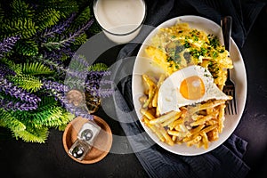 Fried eggs with boiled potatoes and yellow string beans