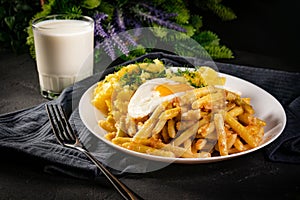 Fried eggs with boiled potatoes and yellow string beans